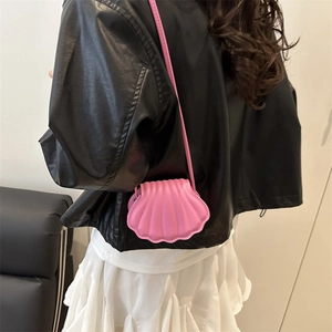 Chic pink shell-shaped crossbody bag for women with elegant quilted pattern and slim strap