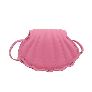 Pink shell-shaped mini shoulder bag made of PU leather with decorative stitching