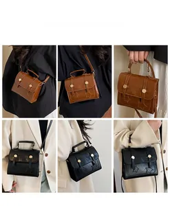 Detail view of vintage crossbody mini bag with star embossing and adjustable strap