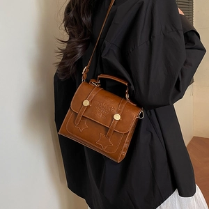 Brown vintage faux leather crossbody bag with embossed lettering and star design