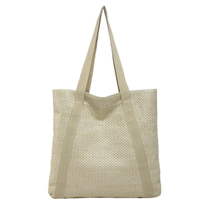 Large beige woven straw tote bag with reinforced handles for beach travel and vacation