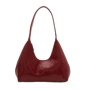 Minimalist burgundy patent leather crescent underarm bag with GAOAD CULT embossed logo
