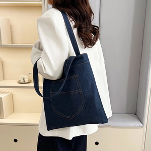 Minimalist large capacity denim tote bag for women with contrast yellow stitching detail