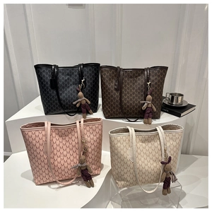 Four large letter-printed tote bags in black, brown, pink and white with bunny charms