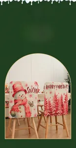 Detail of Christmas chair covers with snowman and pine tree patterns for dining decor