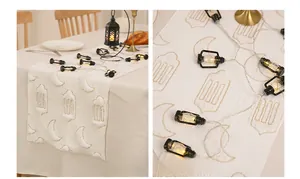 Detailed golden moon and mosque embroidery on white fabric table runner for Ramadan decor