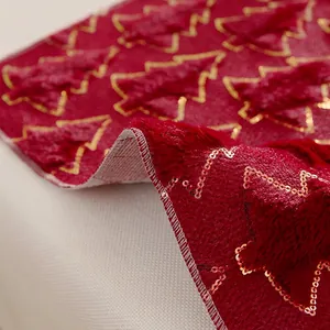 Red Christmas placemat with golden embroidered tree and high-quality white edge stitching