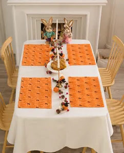 Detail of orange Thanksgiving place mat set with 3D pumpkin textured embroidery