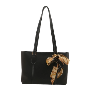 Minimalist black tote bag with white contrast stitching and vintage floral silk scarf