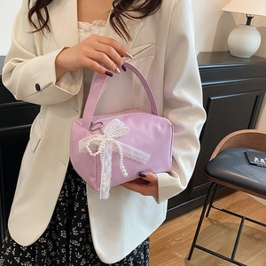 Elegant light purple canvas handbag with lace bow and pearl charm details