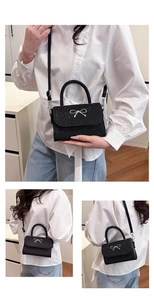 Detail of black sequined crossbody bag with silver bow buckle and adjustable strap