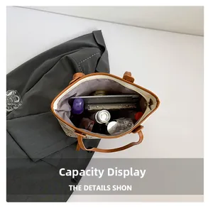 Interior view showing the large capacity of the beige tote bag with various daily essentials