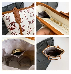 Detail view of large white graffiti tote bag showing zipper hardware and inner pocket
