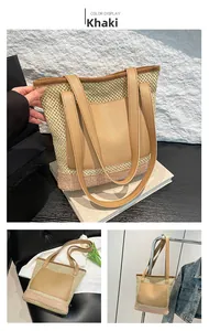 Detail of khaki straw tote bag with pink stripes and large leather pocket for beach