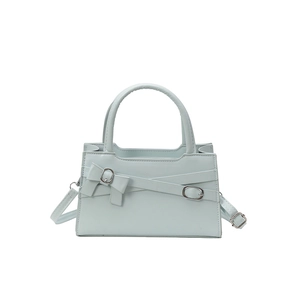 Minimalist light blue square handbag with bow detail and adjustable silver strap buckle