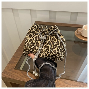 Detail of leopard print bucket bag with silver chain strap and pearl charms decoration