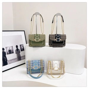Detailed view of tweed square bags in four colors with gold metal chains and buckles