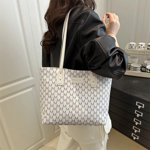 Stylish white tote bag with grey M letter pattern and dual shoulder straps for women