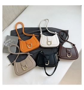 Detailed collection of five stylish leather shoulder bags with gold D-buckles and knotted straps