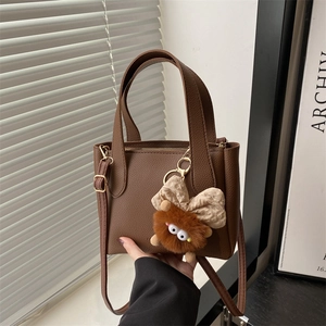 European Vintage Litchi Grain PU Leather Crossbody Bag Small Bucket Style Women Handbag With Monster Charm For Daily Commute