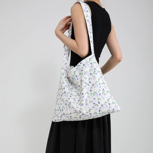 Large floral tote bag for women featuring purple flower patterns on a white canvas background