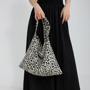 Large leopard print hobo tote bag for women with wide shoulder strap and spacious design