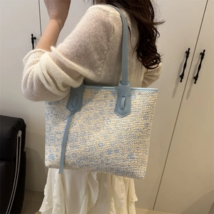 Handwoven summer tote bag with blue floral patterns and leather straps for women