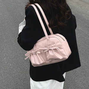 Pink shoulder bag with bows and double front pockets for women in casual summer style