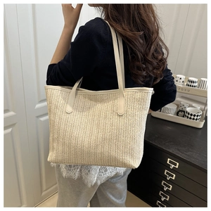 Straw tote bag with herringbone weave and lace lining shown in a lifestyle setting