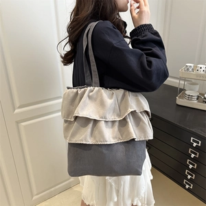 Chic ruffled contrast canvas tote bag with large capacity shown in a minimal home interior