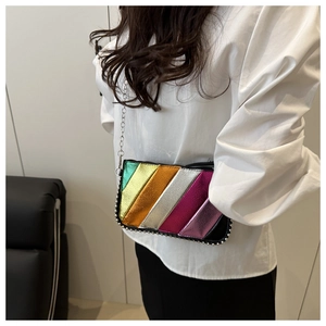 Close-up of rainbow striped crossbody bag with silver chain strap and bead trim details