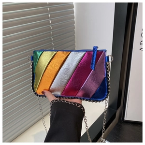 Detailed close-up of metallic rainbow striped PU leather and silver chain strap on a small bag