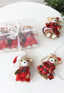 Detailed view of handcrafted sisal Christmas bear ornaments in festive plaid outfits