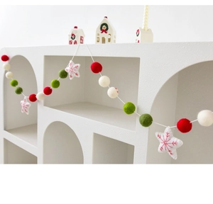 Christmas wool felt ball garland with red green white spheres and embroidered stars