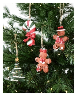 Detail of 4-piece resin Christmas tree ornaments featuring gingerbread man and candy cane