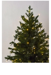 Detail of warm white LED string lights wrapped around a green Christmas tree for festive decor