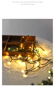 Detail of LED Christmas string lights with 8 modes controller in festive snow scene