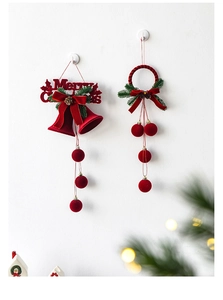 Detail of red velvet Christmas bells and balls ornaments with Merry Christmas lettering