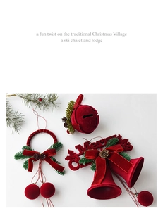 Detailed view of red velvet Christmas bells with faux pine needles and pine cones decor