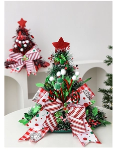 Detail of green sparkly Christmas tree hat with colorful bows and festive ornaments
