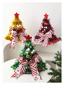 Detailed view of creative mini Christmas tree party hats with star toppers and bows