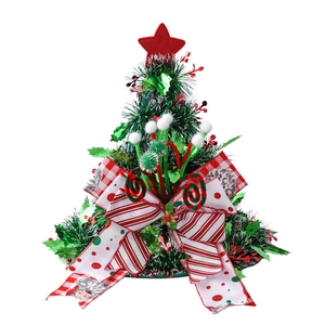 Christmas tree shaped party hat with tinsel, white pom-poms, and a large decorative bow