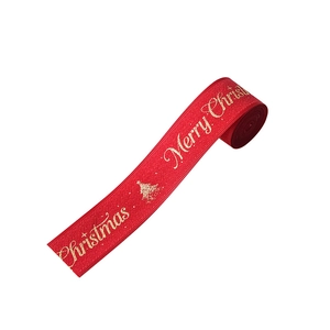 Rotes Weihnachtsband mit goldener Aufschrift für Geschenke und Weihnachtsbaumschmuck