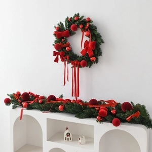 Classic Christmas wreath and garland set with red velvet bows and festive ornaments