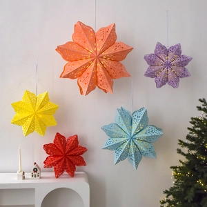 Colorful paper star lanterns with hollow star patterns for Christmas home wall decoration