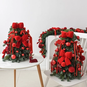 Mini DIY Christmas tree set with red bows, ornaments, and ribbons for tabletop decor