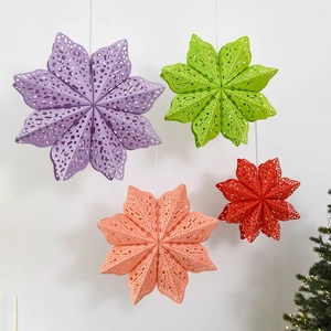 Three-dimensional origami star lanterns in four colors for Christmas tree window decoration