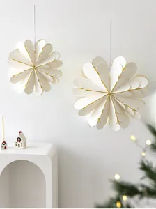 Detail of white 3D paper star ornament with gold edges for Nordic Christmas decor