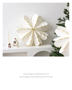 Detail of white 3D paper star decoration with golden foil edges for holiday decor