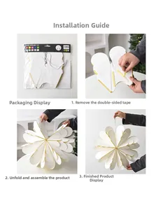 Detail showing the easy assembly of white honeycomb paper star ornaments with gold edges